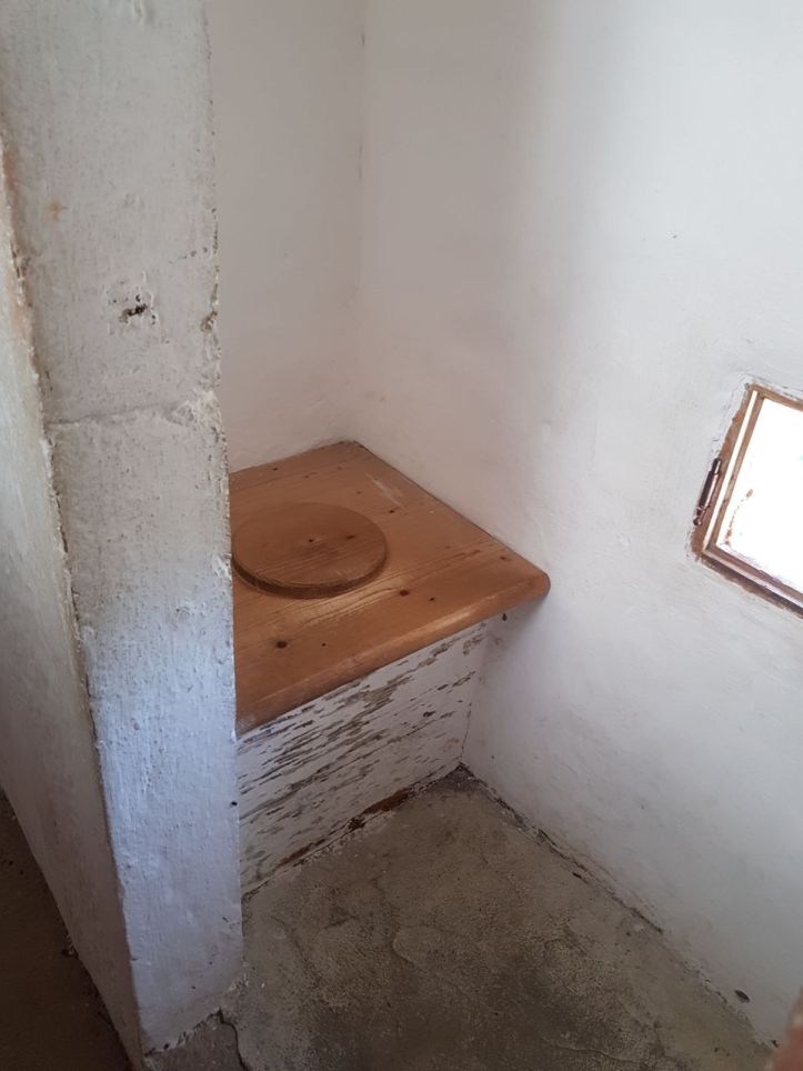 Predjama Castle toilet